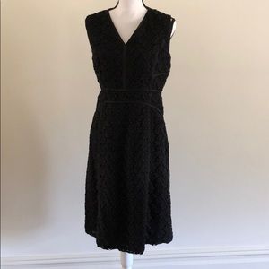 Black A-line dress with crochet overlay